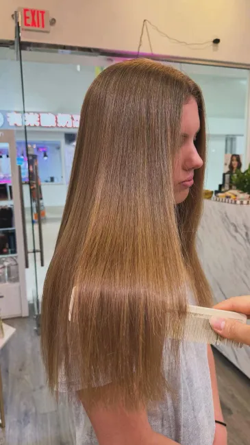 After photo of long straight hair with a sleek finish